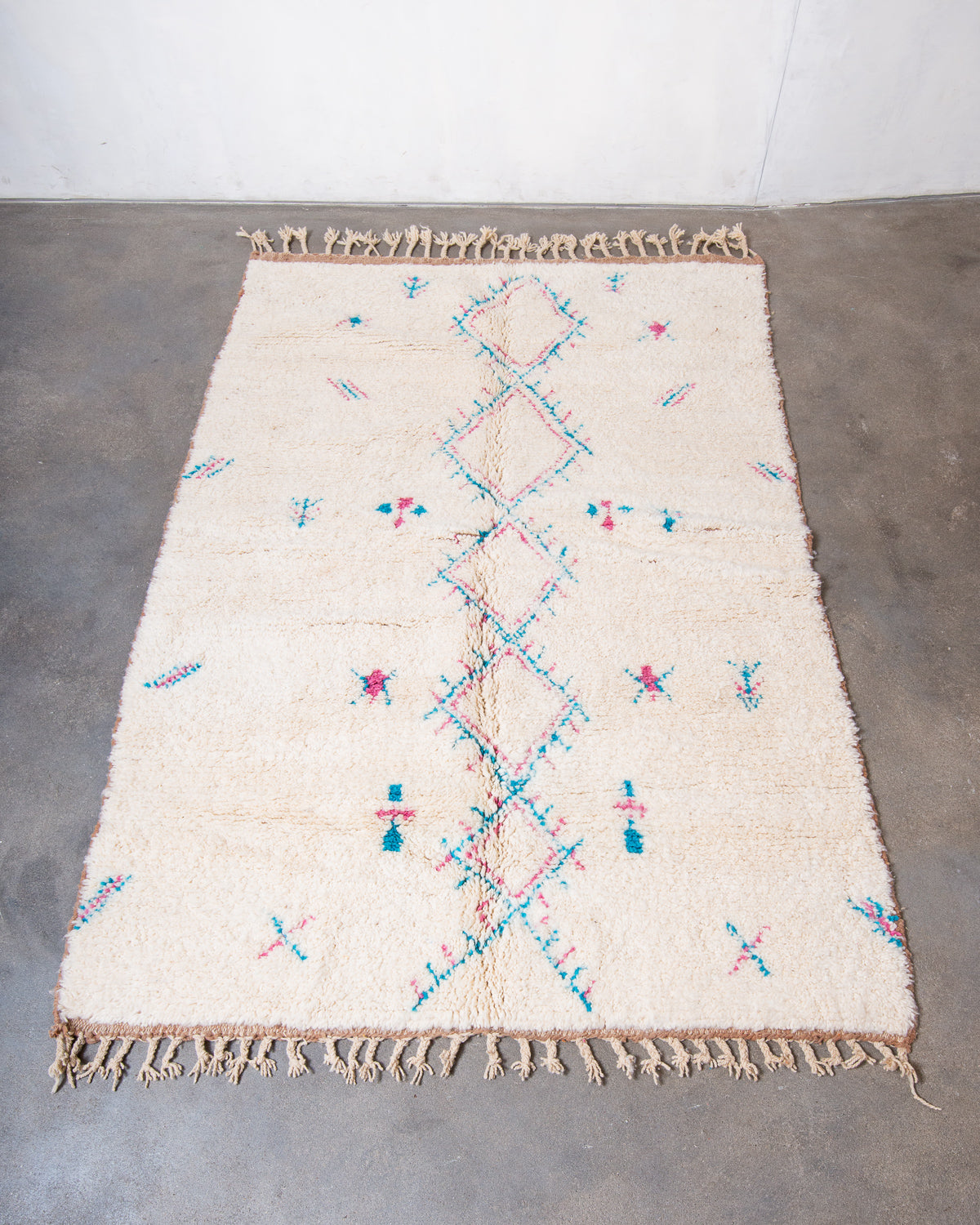 Modern, designer, handcrafted Berber rug from Morocco. Beniourain carpet with beautiful colours and patterns and fluffy wool texture.